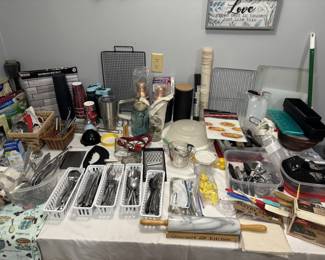 Packed kitchen and housewares table, utensils, gadgets, bakeware, glassware and more