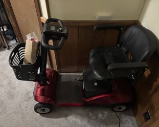 Electric mobility scooter with seat, basket and charger