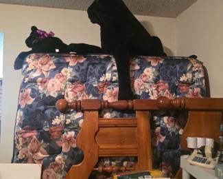 Upstairs - Headboard with mattress & box spring behind, stuffed animalsc