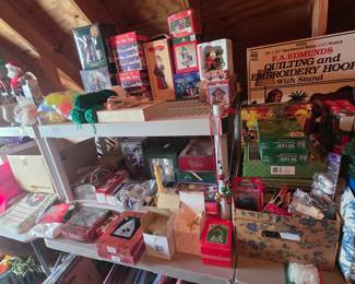 Upstairs in bonus area storage - LOTS of Christmas items, quilting & embroidery hoop - appears to be new in box,