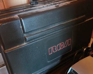 Upstairs in bonus area storage - RCa box with contents, trpewriter