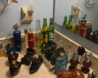 Bathroom upstairs - Men’s cologne & collectible bottles (Royal Crown cola, Mello Yello & 7Up bottles)
