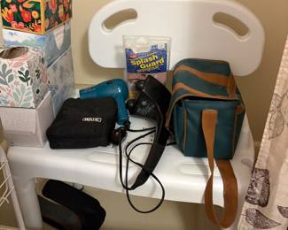 Kleenex, hair dryer, Wahl hair cutting items, splash guard, shower chair