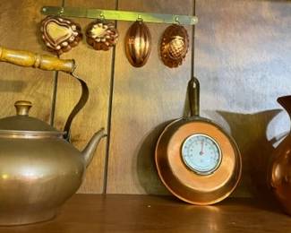 A lot to unpack here Solid brass Round Belly tea kettle, Copper Pan wall thermometer with matching nail attachment, Copper decorative wall molds with brass wall plate, polished copper Tagus pitcher