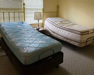 Twin lift beds brass headboards optional and available separate also