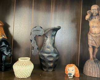 Various African handmade pieces sculpture figure on right is Balinese