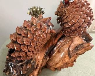 Lacquered Pine cone owsl and brass candle holder on polished natural burl
