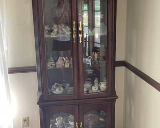 Curio cabinet and collectible figurines