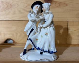 Porcelain Rococo dancing couple figurine with floral accents