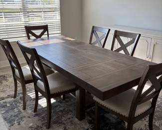Picture showing dining table with chairs