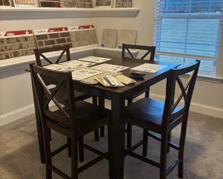Table with 4 high top chairs $240.00 ( chocolate)