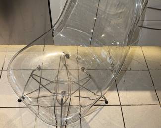 clear acrylic molded shell accent chair with a chrome-plated wire "Eiffel" base