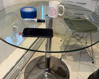 Round glass top bistro table with chrome pedestal base