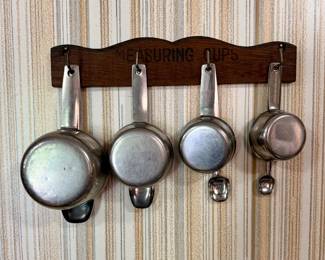 Measuring cup/spoons with wall hanger