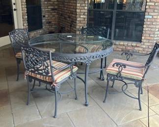 Glass top table with four chairs, custom cushions, powder coated