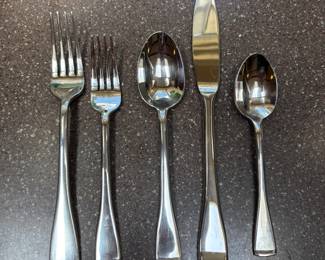 Oneida. 12 place settings plus 4 serving pieces & extra spoons