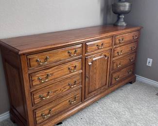Solid wood 12 drawer dresser. Matching set with bed frame and night stand.