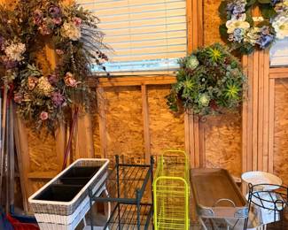 Variety of plant stands and seasonal wreaths