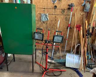 Paint storage cabinet, telescoping light stand, yard tools