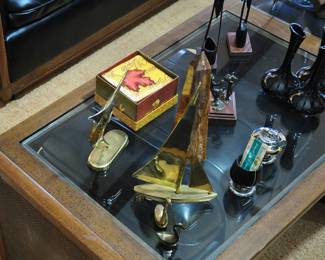 Various decorative items - Sailboat, Swordfish, Stone Obilisk, Van Briggle Pottery,Ronson lighter and cup