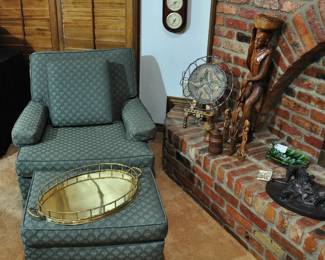 One of several chairs with ottomans