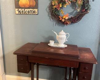 Antique sewing machine cabinet