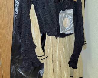Antique Findley Onyx glass that was saved from the warehouse fire in 1891. The dress in the next photo was worn by the lady that was able to save these pieces. The dress has a photo of the lady attached