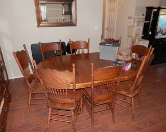 Oak Claw foot base dining table shown with leaf and two sets of 4 chairs each