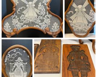 This lot includes framed lace panels in carved wood frames depicting a windmill scene and a Dutch figure in traditional dress, along with two carved wood molds showing figures in Dutch folk costume. The frames feature scrolled and shaped carved wood in a warm finish. A charming grouping for anyone drawn to Dutch folk art or textile display pieces.