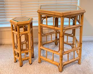 These two hexagonal rattan tables — one taller side table, one shorter accent table — both feature inset glass tops and open lattice-style rattan bases with vertical supports. They share the same construction and finish and display well together or separately. A nice matched set for coastal, boho, or sunroom interiors.