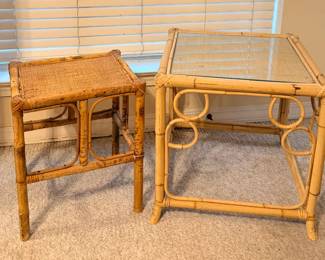 This pair includes a square bamboo-frame table with an inset glass top and circular ring detail at the corners, plus a smaller rattan table with a woven cane top. Both show the warm natural finish typical of rattan furniture. A flexible pair for a sunroom, den, or beside seating.