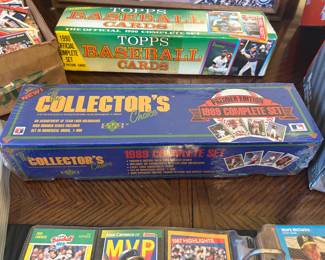 This baseball card lot includes a 1990 Topps Official Complete Set box and a sealed Upper Deck "The Collector's Choice" Premier Edition 1989 Complete Set with team logo holograms, marked as a numerically ordered 1–800 set with high number series. A strong lot for collectors of late-1980s and early-1990s baseball.