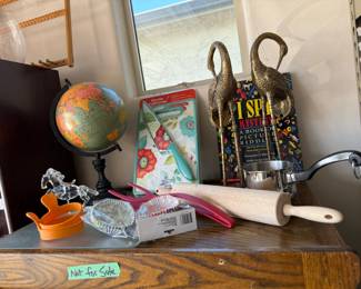 Globe, rolling pin, cutting board, brass birds