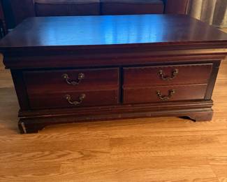 Dark wood coffee table with storage drawers