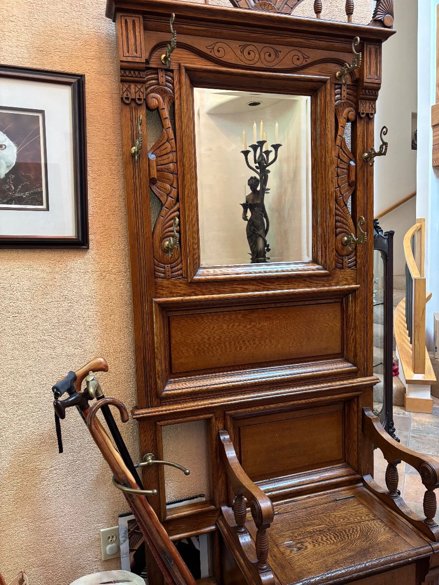 Wonderful Eastlake Hall Tree, Bench with storage, umbrella stand, beveled mirror. In great condition well taken care of.