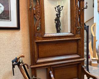 Wonderful Eastlake Hall Tree, Bench with storage, umbrella stand, beveled mirror. In great condition well taken care of.