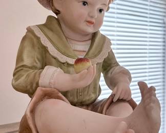 Vintage Bisque Piano Baby Figurine of a Boy with Apple