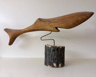 Hand-Carved Wooden Whale Sculpture on Bark-Edged Log Base