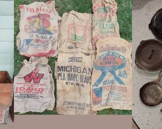 Wagner cast iron pans, Hood’s Soda crate, M&S crate, Borden’s milk crates, burlap bags