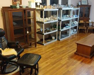 oak slide under table, end tables, glass front hutch, glass front curio cabinet, leather rocker with ottoman, magazine stands, Hamilton electric chime clock, step back kitchen cabinet, glass display case