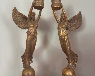 Pair of Regency style composite figural candlesticks, winged figures on sphere circular bases