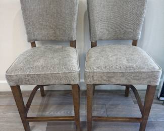 Pair of counter height barstools by nest