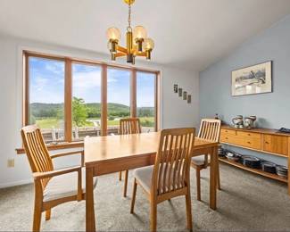 Dining room set includes table and buffet, the pottery is made by a local artisan