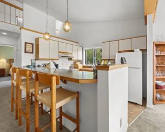 The cupboards are filled with glassware, cookware and dishes too!