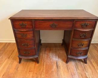 Handsome Vintage BowFront Kneehole Writing Desk w Chippendalestyle Pulls and Flared Feet