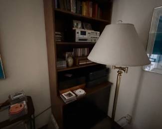 book shelf, lamps, vintage cassette player / tuner, books cds