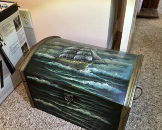 Painted wooden storage chest or trunk with hinged lid.