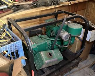 Green shop air compressor or pump and workshop machinery.