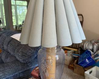 Large vintage table lamp with decorative glass base and pleated fabric shade.