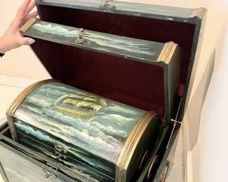 Painted wooden chest with hinged lid.